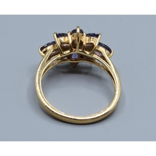 554 - 9ct gold ladies Amethyst star burst design ring size N, 3.33grams