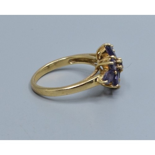 554 - 9ct gold ladies Amethyst star burst design ring size N, 3.33grams