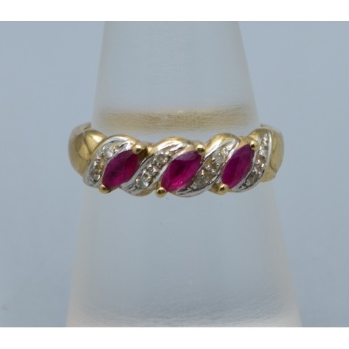 621 - 9ct gold vintage ladies Ruby and Diamond twist design ring hallmarked in the ring as Diamond size M