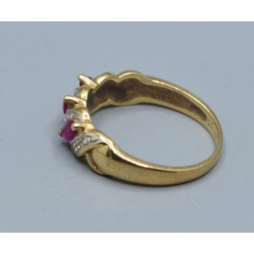 621 - 9ct gold vintage ladies Ruby and Diamond twist design ring hallmarked in the ring as Diamond size M