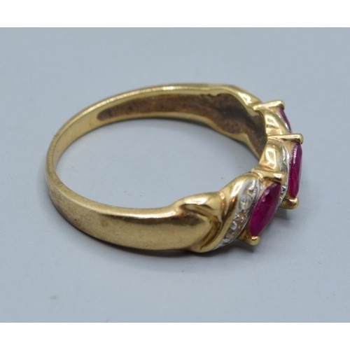 621 - 9ct gold vintage ladies Ruby and Diamond twist design ring hallmarked in the ring as Diamond size M