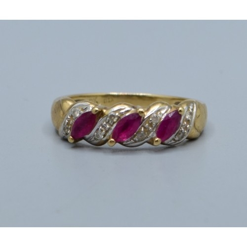 621 - 9ct gold vintage ladies Ruby and Diamond twist design ring hallmarked in the ring as Diamond size M