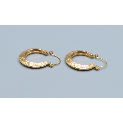 504 - 9ct gold round hoop foliate design earrings 18mm diameter, 4mm widest