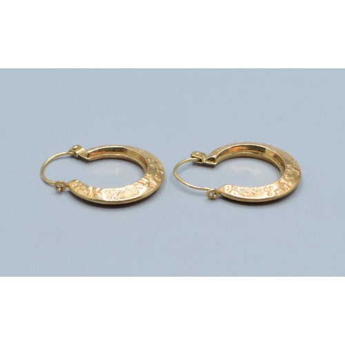 504 - 9ct gold round hoop foliate design earrings 18mm diameter, 4mm widest