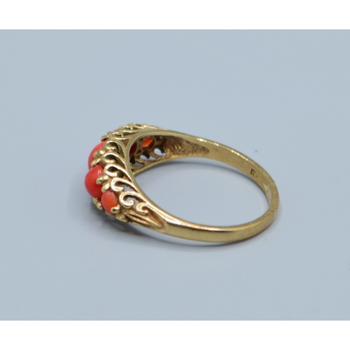 505 - Vintage 9ct gold 5 stone Coral ring held in an open work scroll design size P, 2.9grams