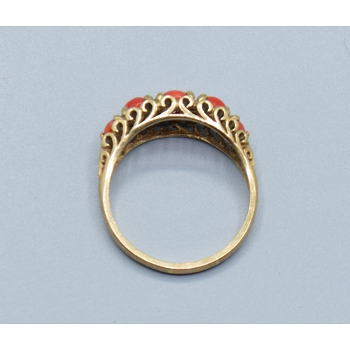 505 - Vintage 9ct gold 5 stone Coral ring held in an open work scroll design size P, 2.9grams