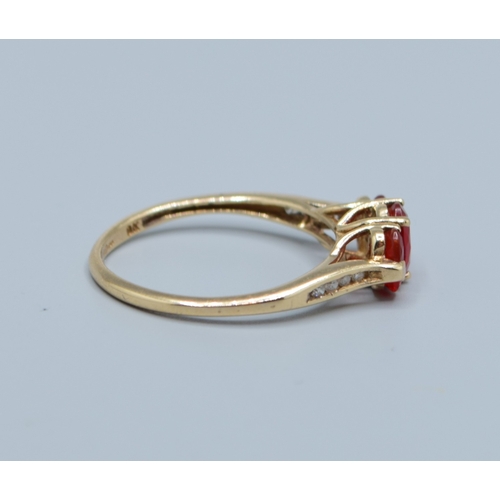 511 - 9ct gold ladies enhanced Ruby 3 stone dress ring with accent Diamond decoration to the shoulders siz... 