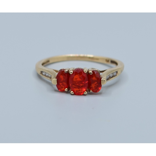 511 - 9ct gold ladies enhanced Ruby 3 stone dress ring with accent Diamond decoration to the shoulders siz... 