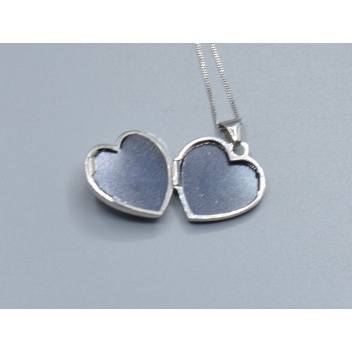 553 - 9ct white gold Heart picture locket on a 9ct white gold neck chain 40cm long