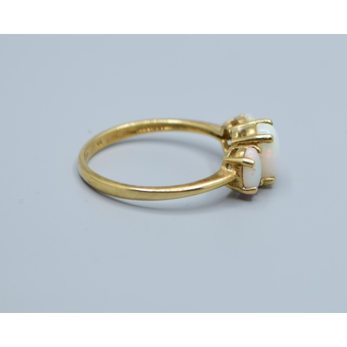 546 - 9ct gold ladies 3 graduating oval Opal ring set in a claw design largest stone being 8x6mm size S