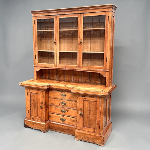 1 - A 19th century glazed Pine farmhouse dresser.Three glazed panels to top above twin cupboards and fou... 