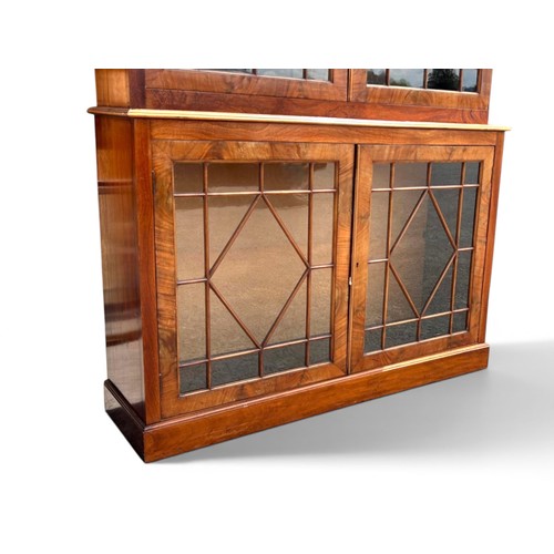 2 - A Regency period Mahogany glazed bookcase.Astral glazed doors to upper & lower sections, with br... 