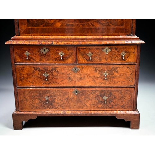3 - A Queen Anne Walnut drop front escritoire.Stepped moulded cornice above a long drawer, with fall fro... 