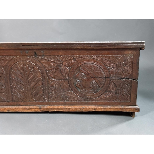 6 - A late Elizabethan Oak marriage chest.With carved portrait medallions and stylised designs.Late 16th... 