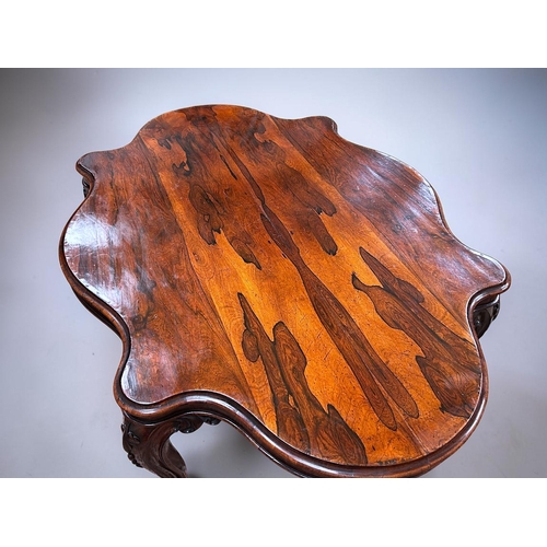 7 - A George III Rosewood centre / dining table.Early 19th century.Serpentine top, with carved legs and ... 