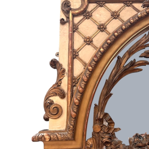 13 - A very large French Louis XVI Giltwood Trumeau mirror.Late 18th century.Central carved Putto motif a... 