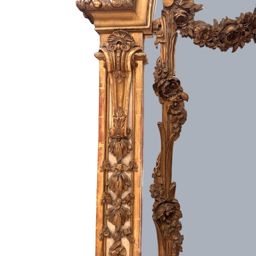13 - A very large French Louis XVI Giltwood Trumeau mirror.Late 18th century.Central carved Putto motif a... 