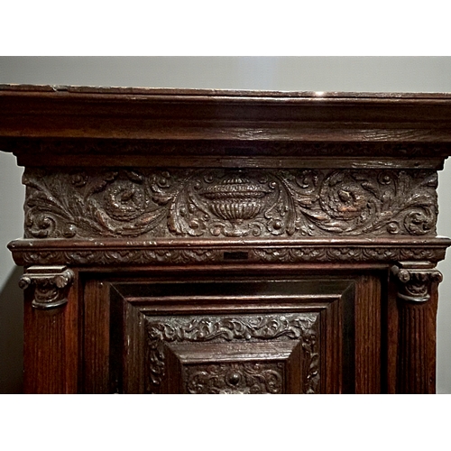 17 - A 17th/18th century Flemish cabinet on stand.Heavily carved Oak depicting foliate, vase and Lion dec... 