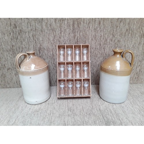 41 - 2 stone ware flagons and set of Spice jars