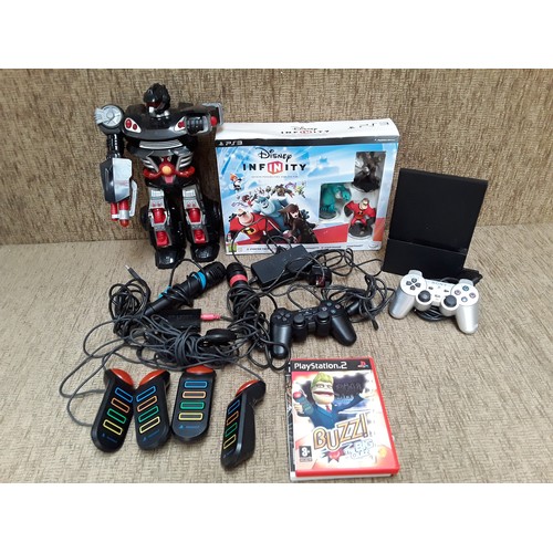 46 - PlayStation 2 with games and accessories and vintage robot