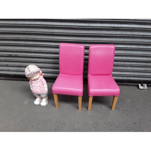 157 - Two pink kids chairs, and a chalk figure