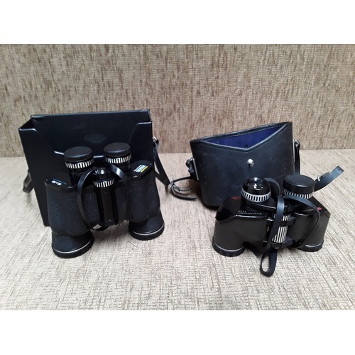 62 - Two pairs of binoculars including Halina Sight setter 16 x 50, and Chinon countryman 7x35