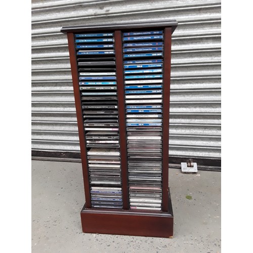 193 - Mahogany Cd rack with CDs and one other in maple