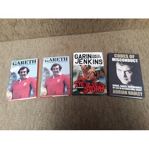 753 - Four signed rugby books, including Gareth Edwards, Garin Jenkins, and Adrian Hadley