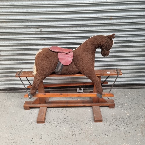 5 - Vintage rocking horse with wooden frame.