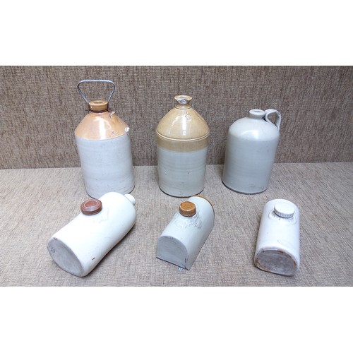 143 - Collection of Stoneware decanters and hot water bottles.