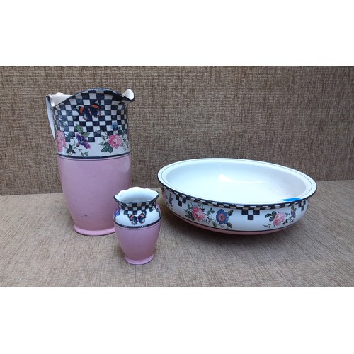 150 - Stoneware wash bowl, jug and vase with floral design.