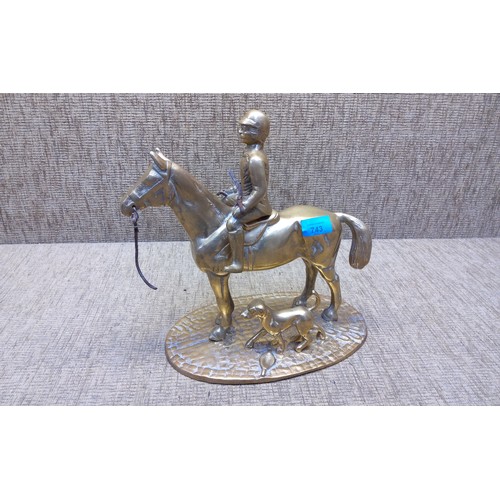 743 - Large solid brass figure of a huntsman on horseback.