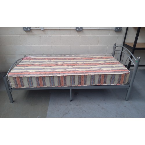 17 - Metal framed single bed and mattress.