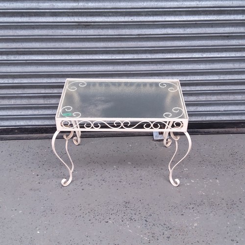 35 - cast iron and glass topped conservatory table.