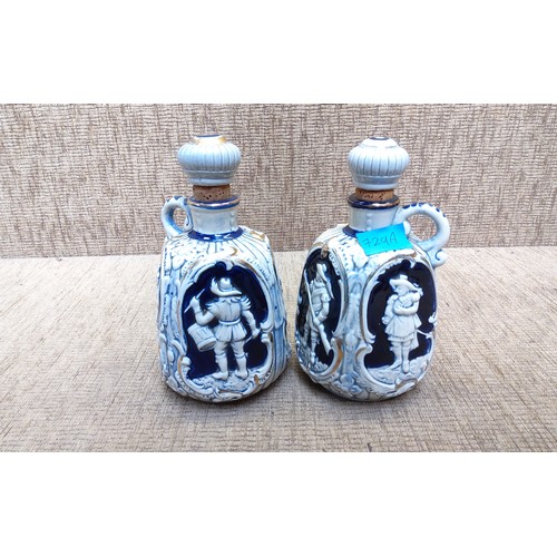 729A - Pair of antique musical blue and white sherry bottles.