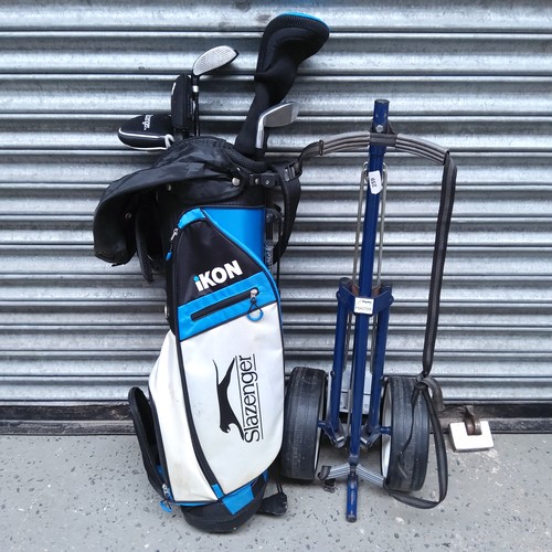 259 - Junior part set of golf clubs with driver and golf trolley.