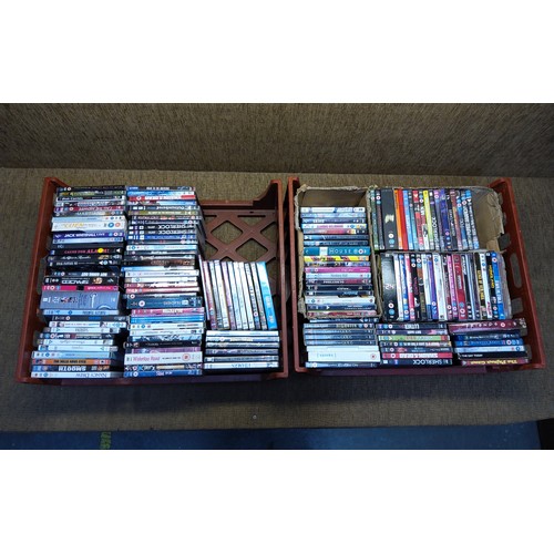 260 - Two large bread crates of DVDs.