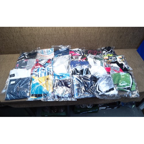 296 - Selection of retail packaged clothes including motor cross tops , billabong and fox .