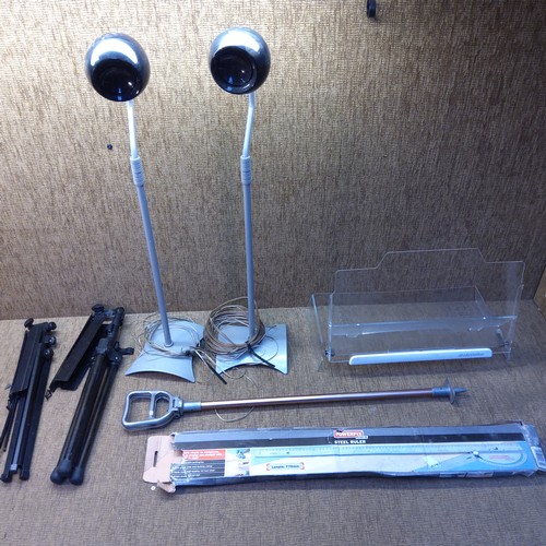 310 - Mixed items including two metal music stands a pair of surround speakers, and a steel ruler.
