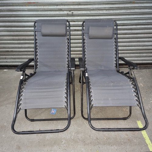 312 - Pair of metal sun loungers.