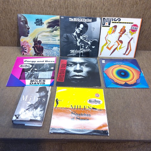 72 - 7 Miles Davies albums and books including Bitches Brew.