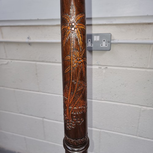 661 - Wooden carved oriental tall standing lamp 180cm tall.