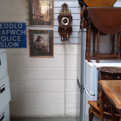 724 - A 1970s Zaanse wall mounted wooden and brass clock made in Holland.