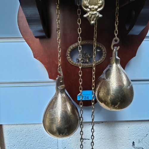 724 - A 1970s Zaanse wall mounted wooden and brass clock made in Holland.