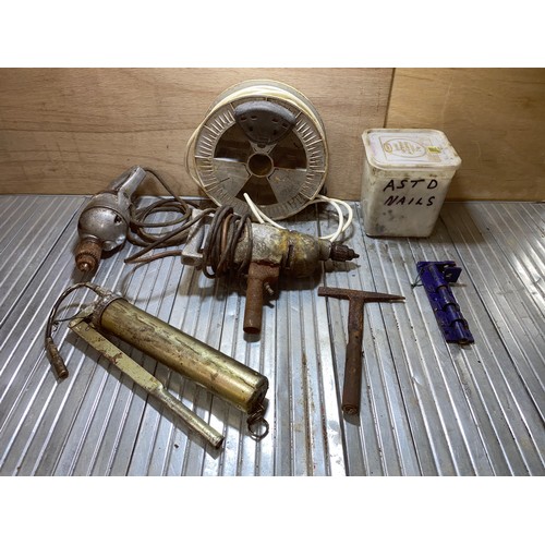 21 - Two Metal power drills, a extension reel and a large ice-cream box full of galvanized nails.