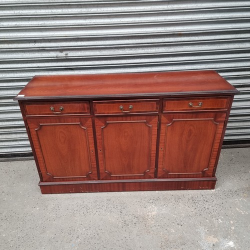 40 - Wooden three draw sideboard.