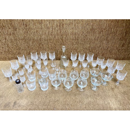 61 - Large quantity of crystal glass including brandy glasses and a decanter