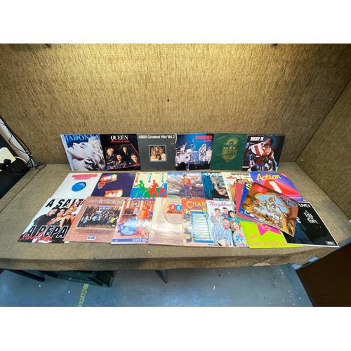 665 - Vinyl albums including Abba and Queen (records and covers showing age related marks).