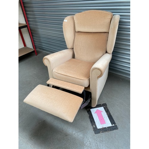 56 - peach coloured reclining chair