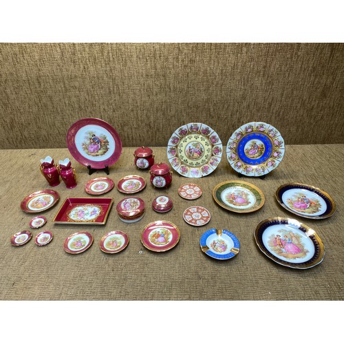 459 - Collection of Limoges of France plates, trinket boxes and small vases.